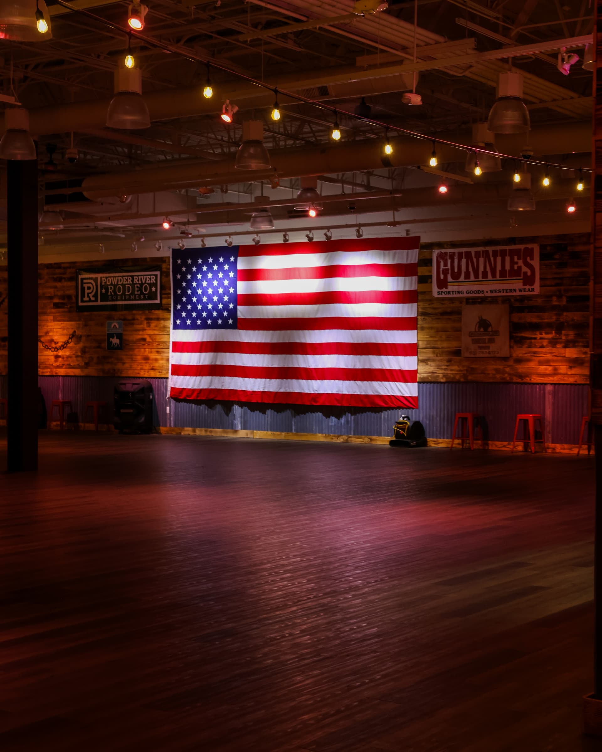 The Barn interior with American flag and string lights